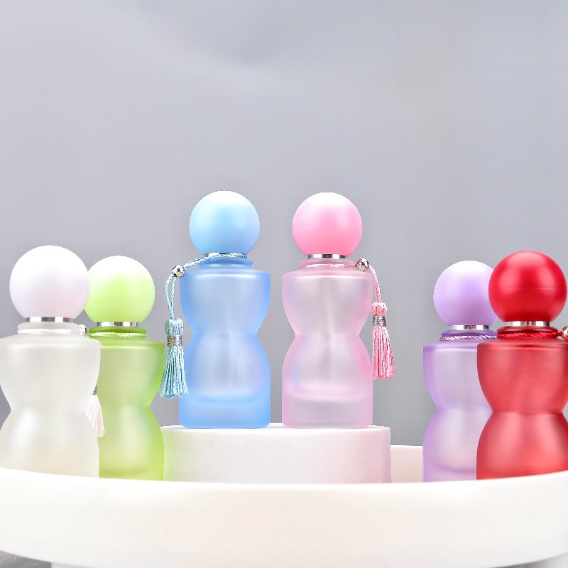 Pastel and bright fragrance bottles with rounded caps