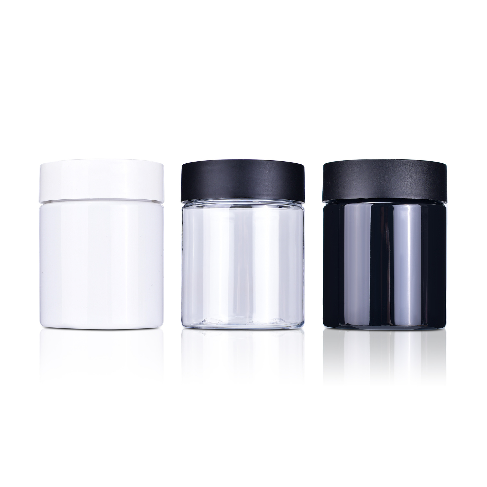 Clear, white and dark cosmetic jars with white and black lids